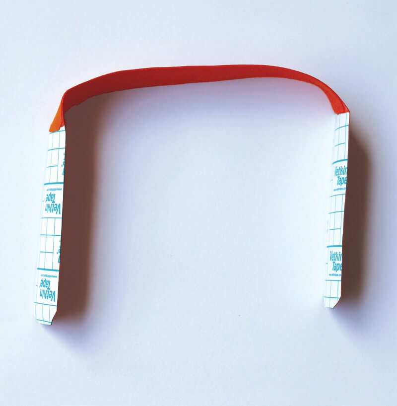 Two tape strips joined together to form a loop